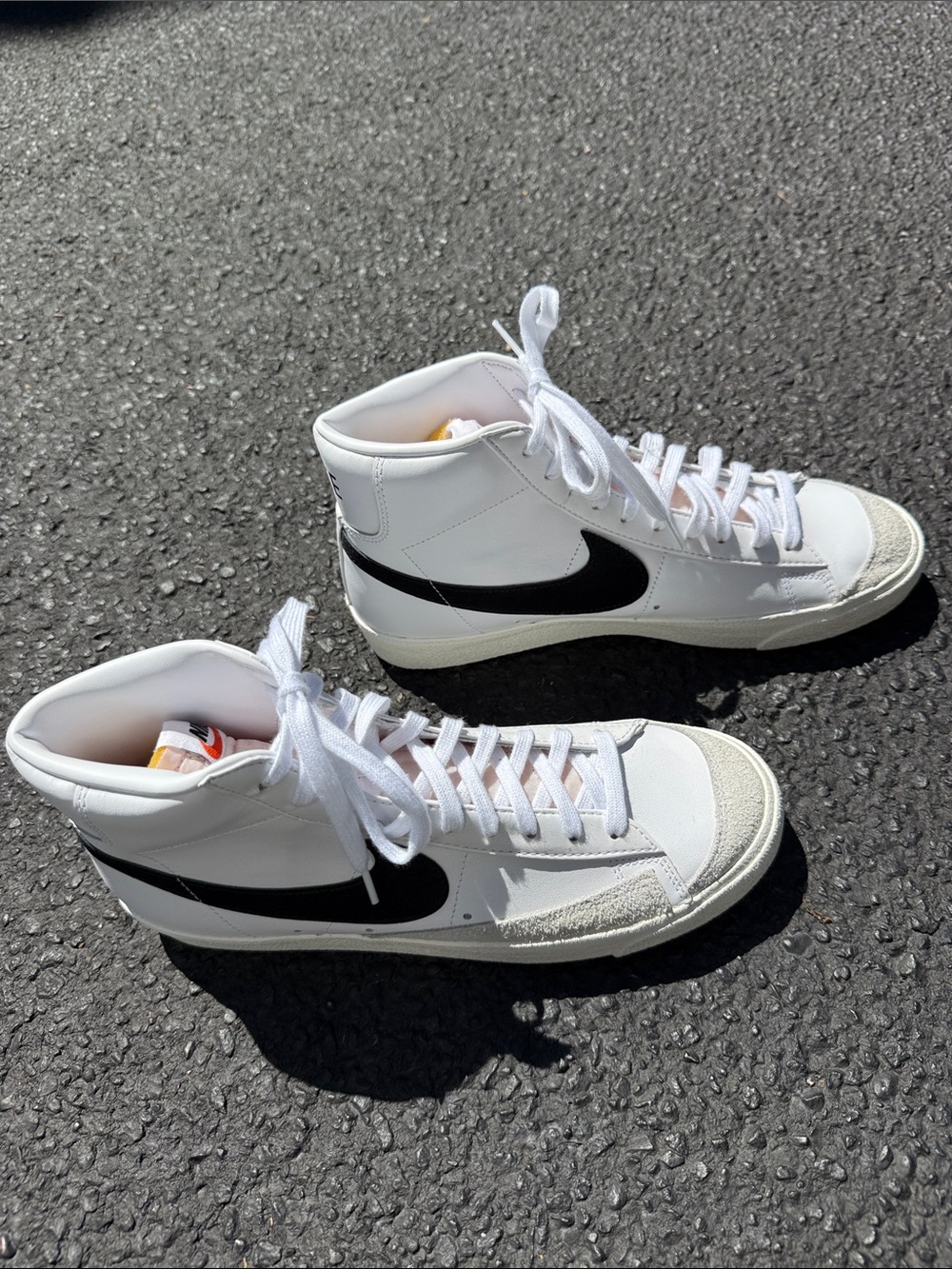 Nike White High-Top Sneakers with Black Swoosh